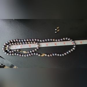 Set of black pearl necklace, bracelet and earrings
